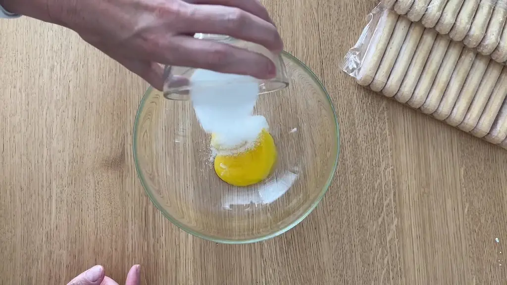 add sugar to egg yolks