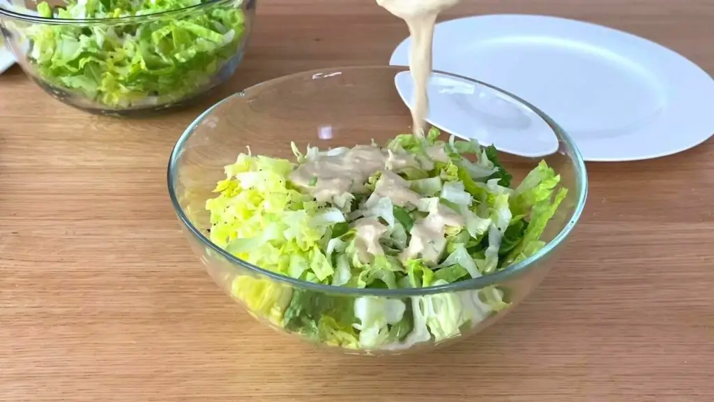 mix dressing and lettuce