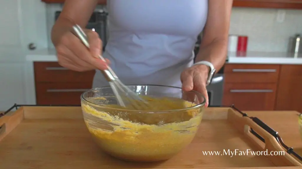 mix the batter for pumpkin cheese muffins