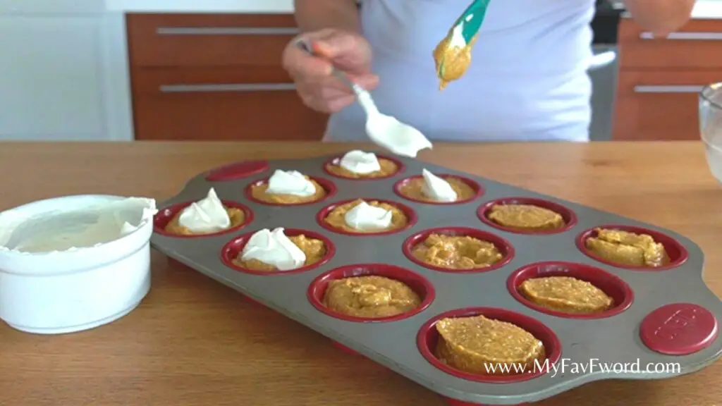 filling pumpkin muffins with cheese filling