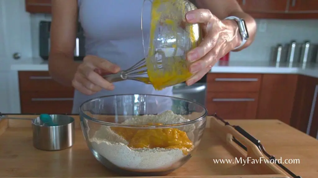 add wet ingredients to dry for pumpkin cheese muffins