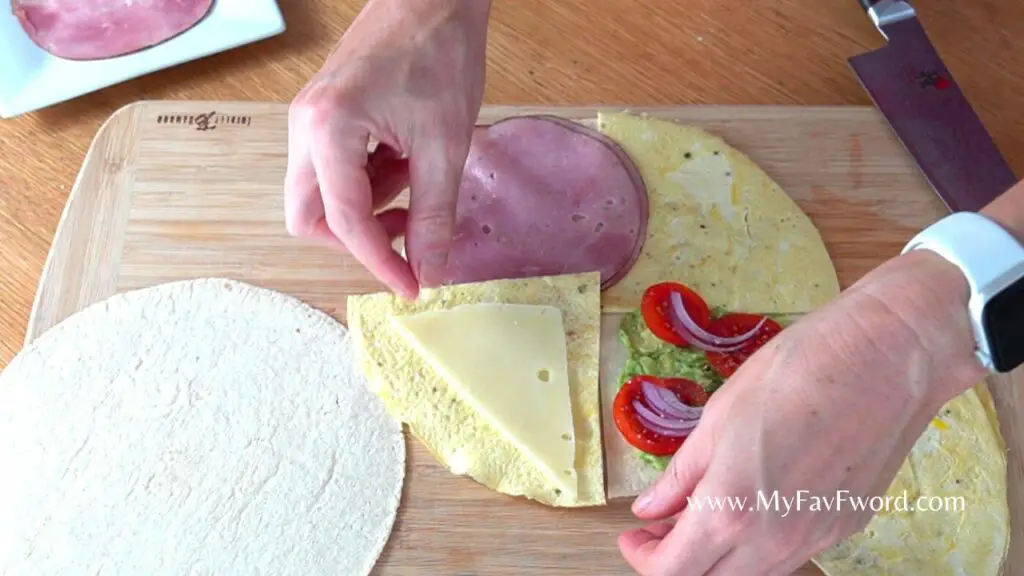 adding ingredients to tortilla