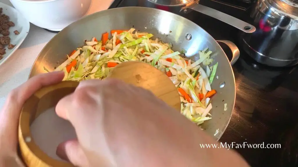 adding vegetables to beef stifry 