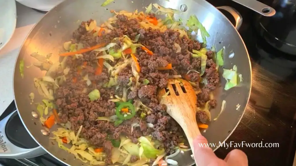 adding beef to beef stirfry